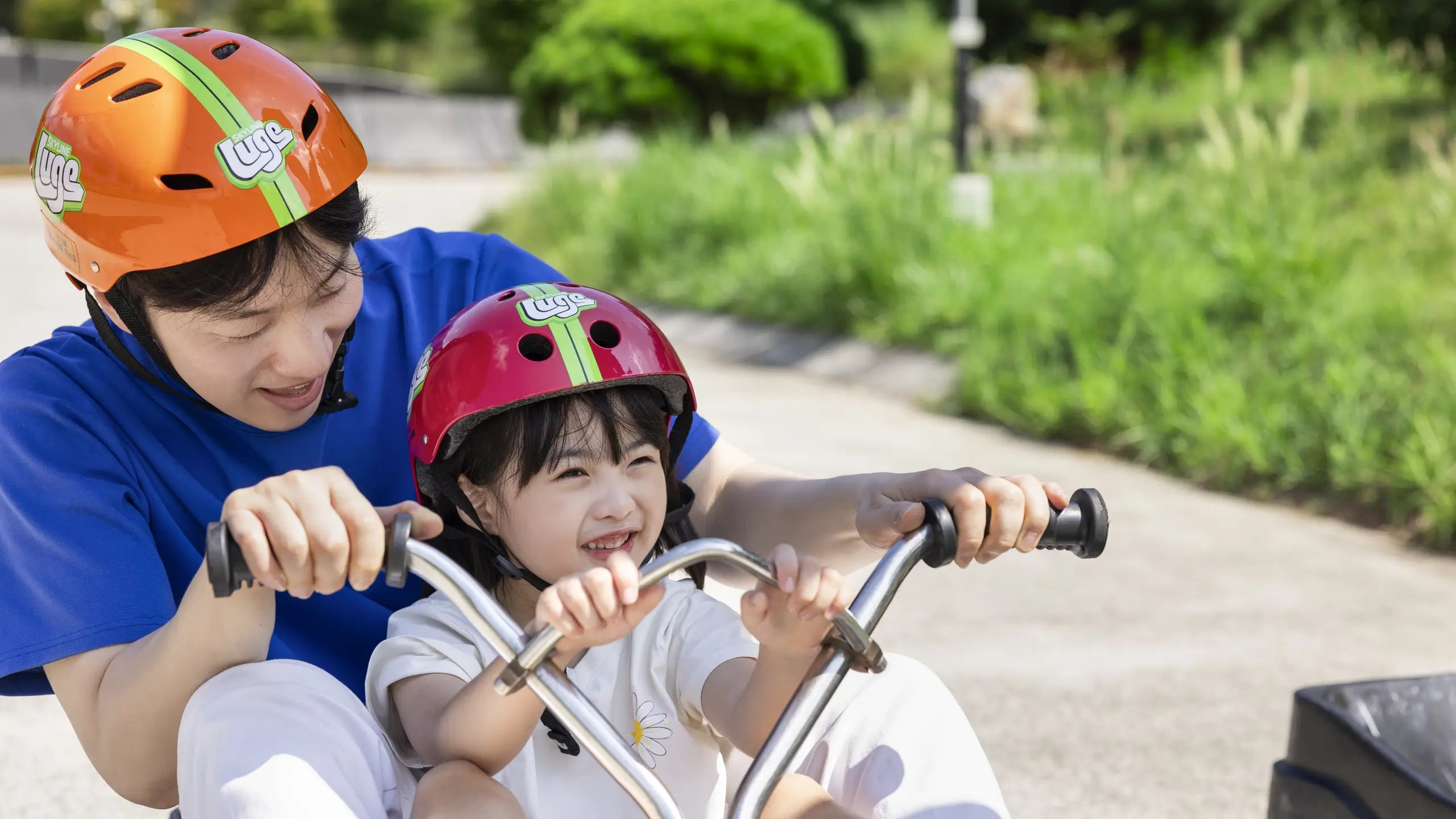 Family tandem luge ride at Skyline Luge Tongyeong.