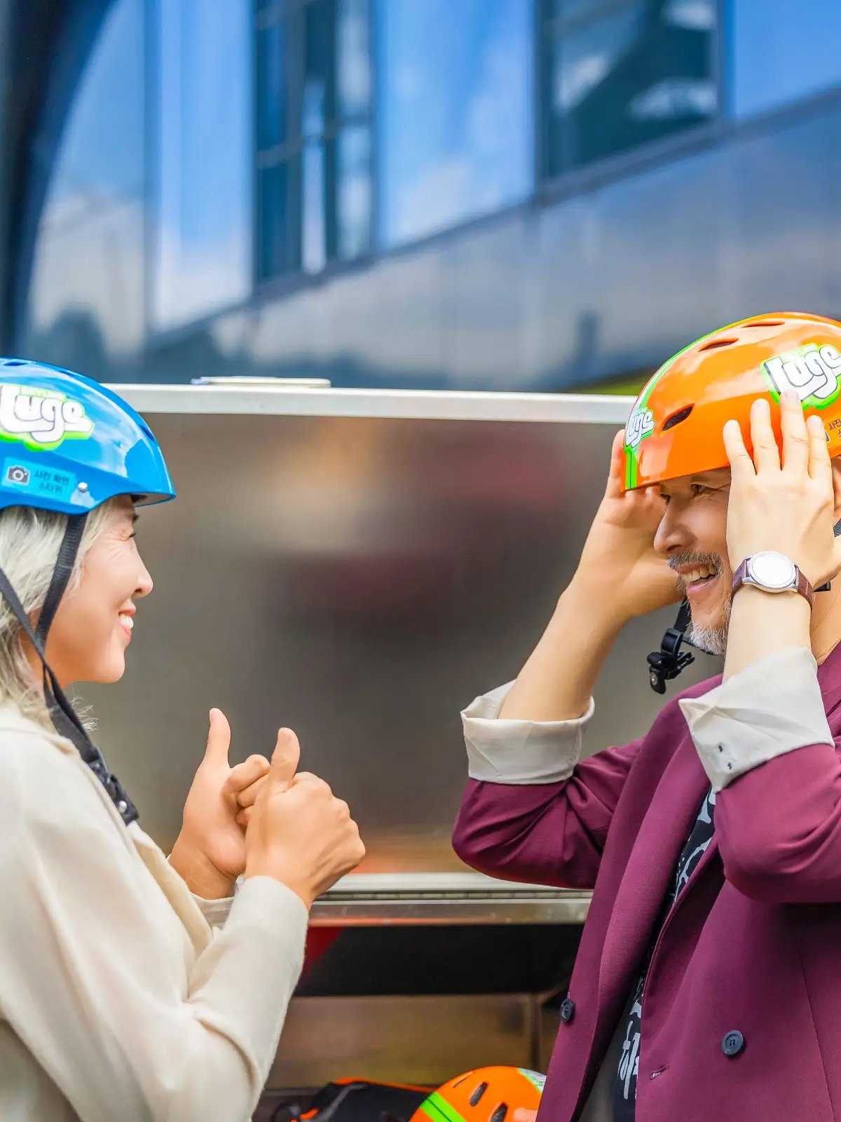 Guests fitting helmets before riding at Skyline Luge Tongyeong.