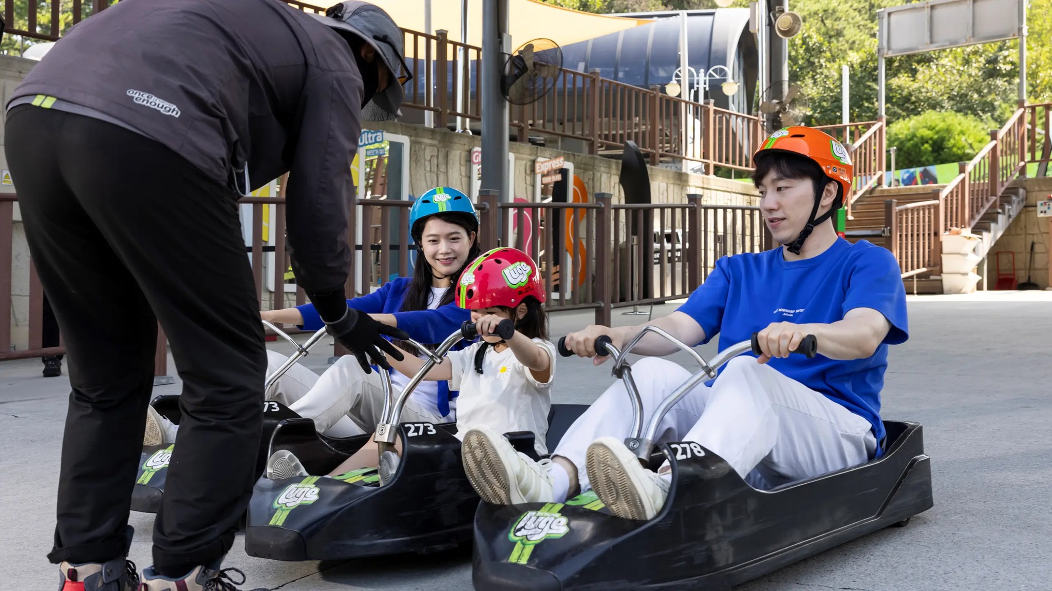 Staff providing a safety briefing to riders at Skyline Luge Tongyeong before their run.
